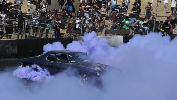 A driver takes part in the Burnout Championship finals at Canberra Summernats.