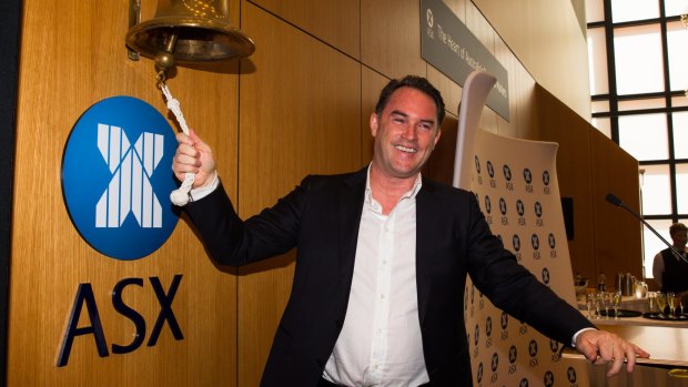 John McGrath in happier times, ringing the bell as his real estate company floated on the ASX. 