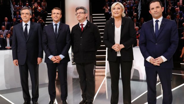 Candidates from left:Francois Fillon, Emmanuel Macron, Jean-Luc Melenchon, Marine Le Pen and Benoit Hamon pose before the debate.