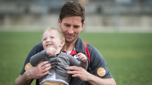 Proud: Western Bulldogs veteran Matthew Boyd with son James. 