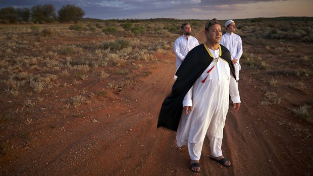 Place in the sun: Shaykh Murshid Ali (at front) with his Sufi group's Australian-born "spiritual caretaker" Dawud Abu Junaid Gos (at left) and Sa'im McIntosh on the outskirts of Broken Hill.