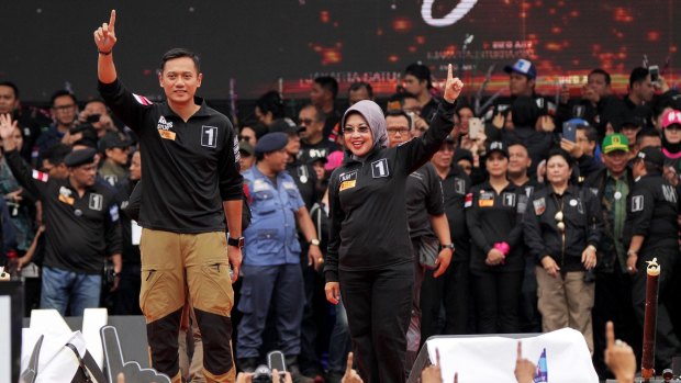 Jakarta gubernatorial candidate Agus Harimurti Yudhoyono, left, with his running mate Sylviana Murni  at a rally on February 11.