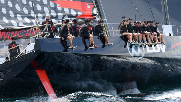 Expected leaders: The crew of LDV Comanche sit on its side during a practice sail.