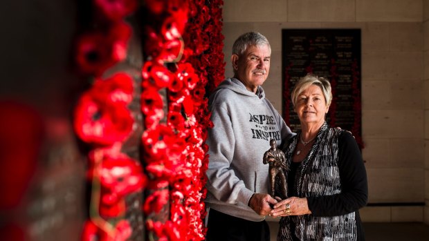 Doug and Kaye Baird with a statue of their son Cameron Baird, who was the 100th Victoria Cross recipient. It's being awarded to the best on ground at the Anzac Test.