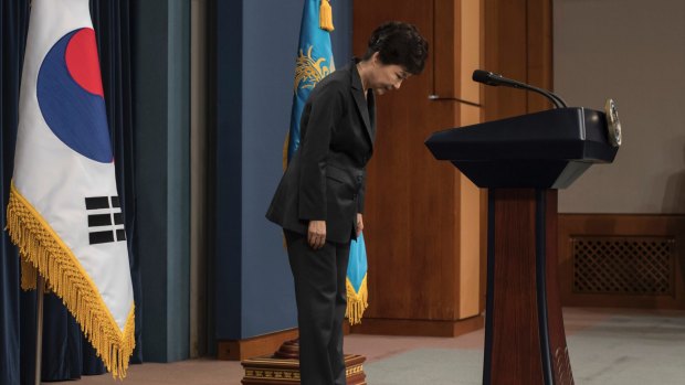 South Korean President Park Geun-hye bows before addressing the nation over a "heartbreaking" scandal at the presidential Blue House in Seoul. 