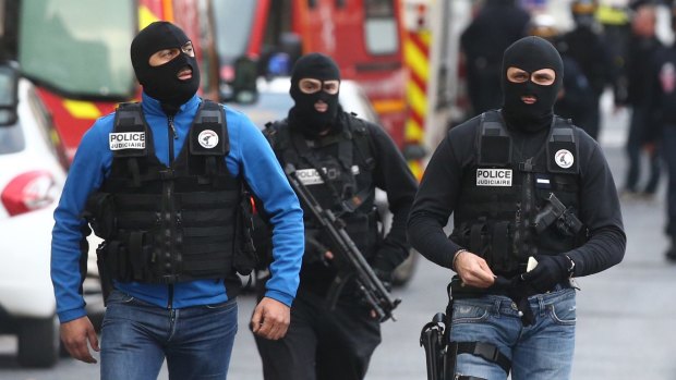 Military and police conduct an operation in St Denis in Paris on Wednesday. 