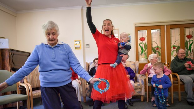 Sonja Olsen (in the red skirt) runs an intergenerational playgroup in Melbourne's east.