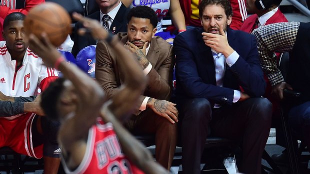 Keeping a close eye on proceedings: Derrick Rose watches as Jimmy Butler tries to score against the Clippers.