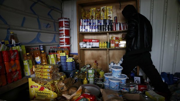 Migrants in a make-shift tent city in Calais, France, on Tuesday. 