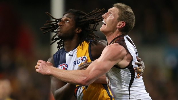 Nic Naitanui and Ben McEvoy of the Hawks contest the ruck.