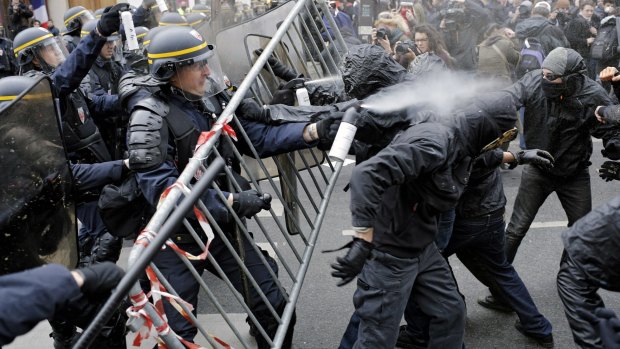 Policemen fight with activists during a protest at the place de la Republique, in Paris ahead of the climate conference.