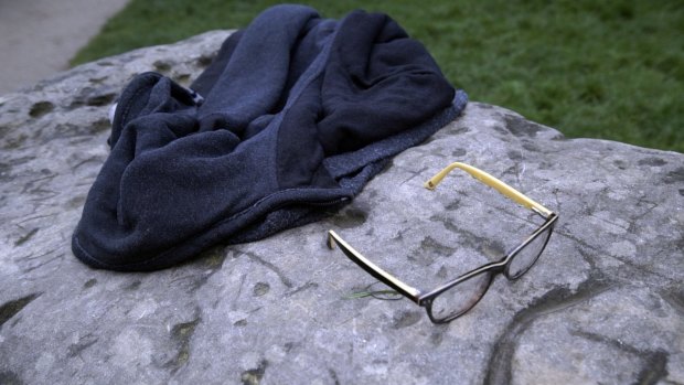 A child's glasses and a jacket lie on a rock in the Parc Monceau after the lightning strike which left 11 people injured.