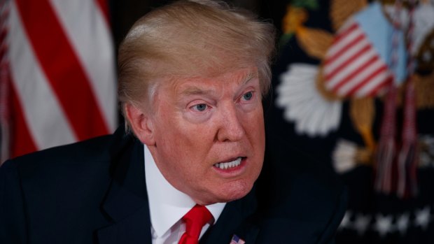 US President Donald Trump warns North Korea during a press conference at the Trump National Golf Club.