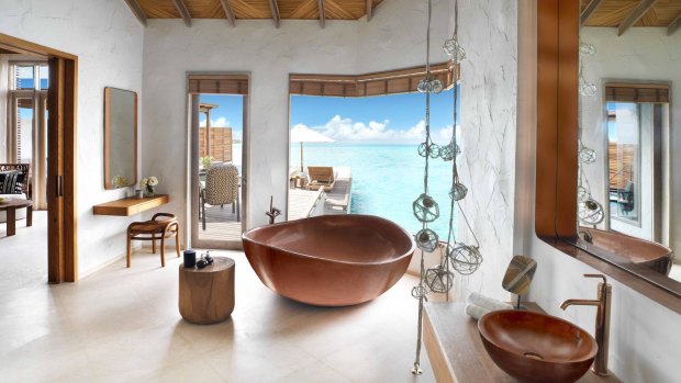 A bathroom of a Water Villa Premium, Fairmont Maldives.
