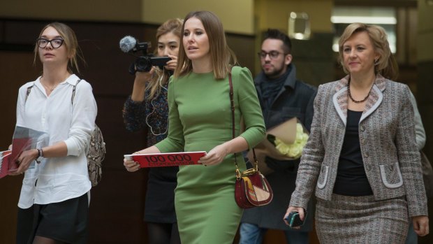 Russian celebrity TV host Ksenia Sobchak, centre, also wants to challenge Russian President Vladimir Putin in the March 18 presidential election.