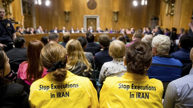 Protesters sit in the audience during the Senate foreign relations committee meeting on Iran.