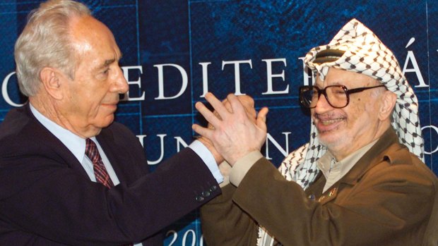 Israeli Foreign Minister Shimon Peres, left, with Palestinian leader Yasser Arafat in Spain in 2001.