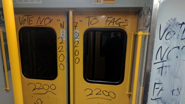 A train vandalised in Sydney with "no" graffiti.