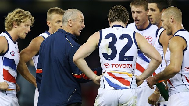 Adelaide coach Phil Walsh speaks to his players.