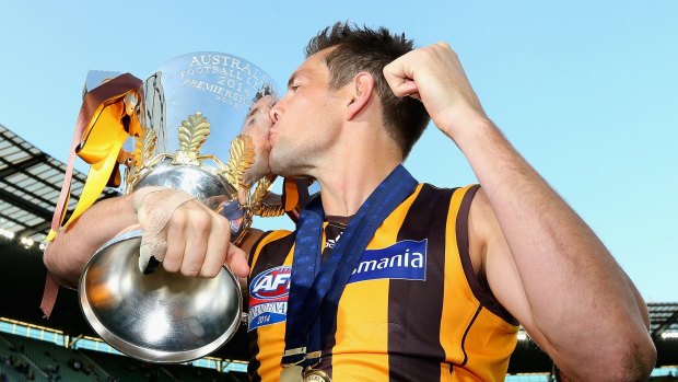 Luke Hodge of the Hawks  kisses the Premeirship Cup during the 2014 AFL Grand Final match.