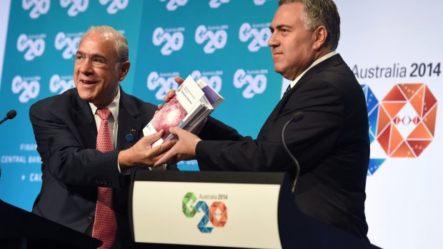 Former Treasurer Joe Hockey with OECD secretary-general Angel Gurria at the G20 Finance Ministers and Central Bank Governors Meeting in Cairns in 2014 when the OECD plan to stop multinational tax evasion was discussed.