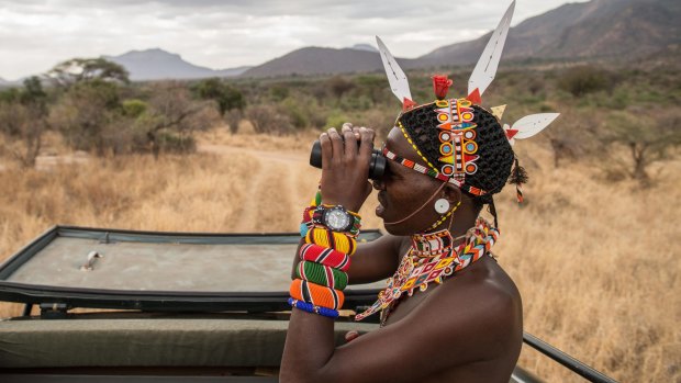 A Sarara Camp lodge guide searches for wildlife.