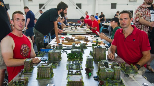 Sam Allan of Maitland and Geoff Orton of Brisbane take part in the miniatures gaming. 