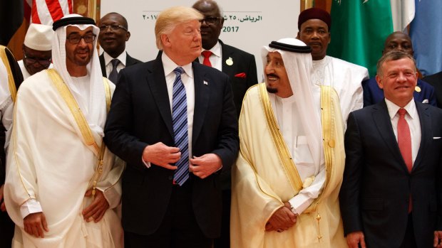 President Donald Trump talks with Saudi King Salman at the Arab Islamic American Summit. Mr Trump likely hoped that his trip abroad would distract from the turmoil at home.