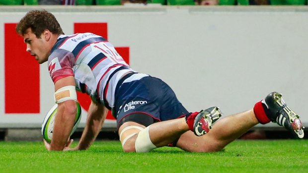 Tom English scores a try against the Reds on Friday.