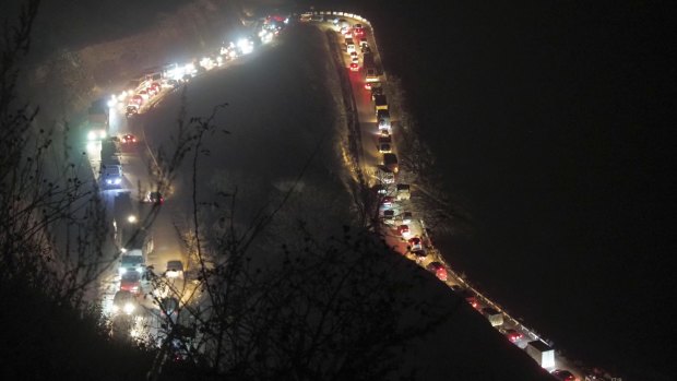 Cars and trucks stuck in a huge traffic jam climbing along the road from Kalbajar to a mountain pass leaving the separatist region of Nagorno-Karabakh to Armenia after the region was ceded to Azerbaijan.