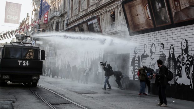 Police use water cannon and teargas to disperse people protesting against security operations against Kurdish rebels in southeastern Turkey.