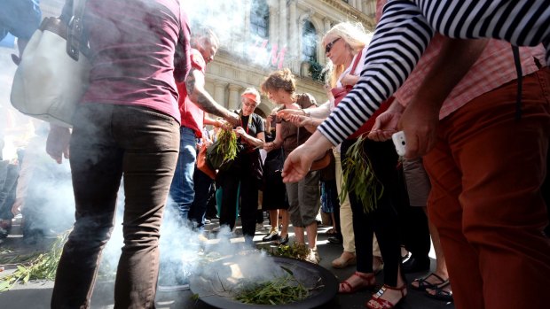 Traditional land owners held a smoking ceremony to bless the land before the removal began
