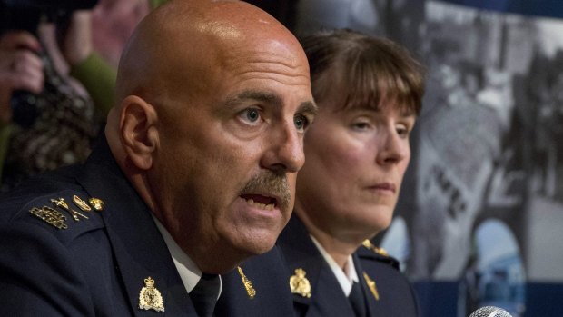 'We can't do that': Royal Canadian Mounted Police Deputy Commissioner Mike Cabana, left, explains the limitations of police powers in dealing with radicalised individuals.
