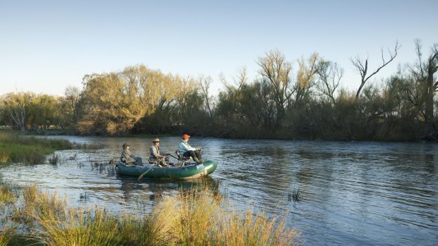 A small boat plies the marshland near the Tahbilk winery restaurant.