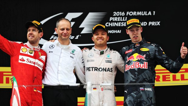 Controversial race: Winner Nico Rosberg, second from the right, Sebastian Vettel, left,  and Daniil Kvyat, right, on the podium at the Chinese Grand Prix. 
