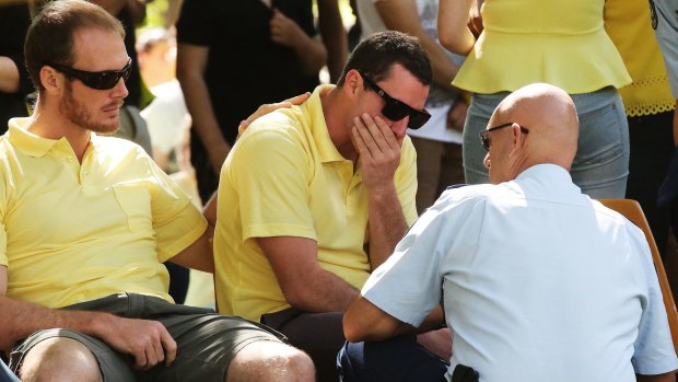 Detective Superintendent Michael Rowan, Griffith police local area commander (right), talks with Aaron leeson-Woolley (centre), the fiance of murdered Leeton school teacher Stephanie Scott.