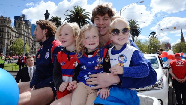 The Bulldogs' Liam Picken with his children at the parade.