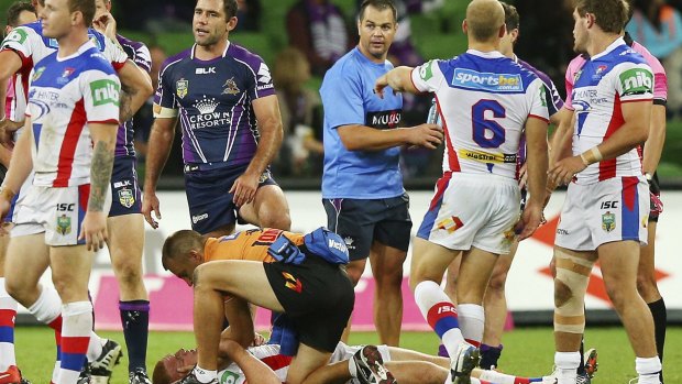 Turbulent times: The fateful tackle that left Alex McKinnon in a wheelchair.