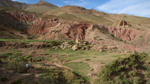 Trekkers traverse the floor of M'Goun Valley, Morocco.