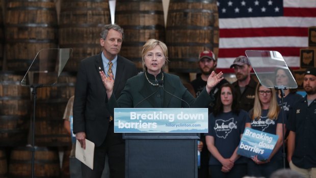 Democratic presidential candidate Hillary Clinton with Senator Sherrod Brown (left) at Jackie O's Production Brewery in Athens, Ohio, on Tuesday.