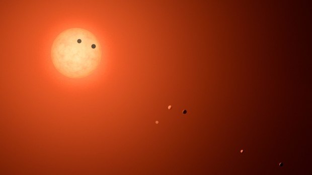 Artist's concept of 7 Earth-sized planets orbiting TRAPPIST-1.