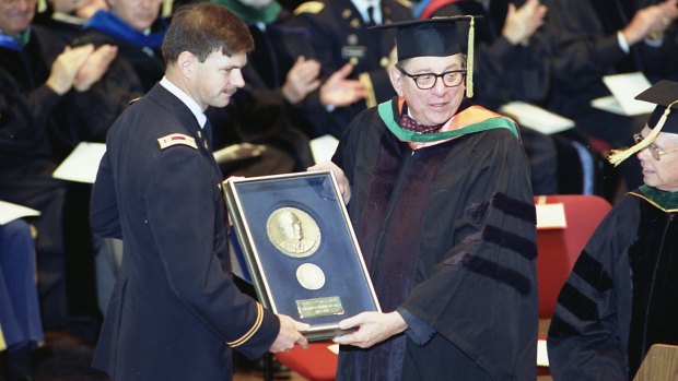 US Army Medical Corps retired Lt. Colonel John Hagmann, left, is seen being presented the William P. Clements, Jr. Outstanding Uniformed Educator Award by Dr Sam Nixon in 1989.