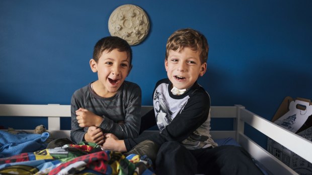 Seven-year-old Dominic McFadden, right, who lives with autism and a tracheostomy, at home with his brother Sebastian, 8. 