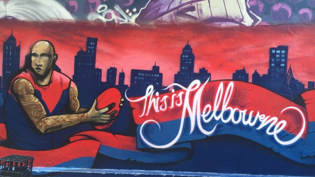 Wall game: Demons captain Nathan Jones features on Hosier Lane.