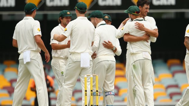 Australia celebrate  after Mitchell Starc took the wicket of Trent Boult to seal victory by 208 runs in the first Test.