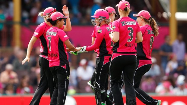 In the pink: Lisa Sthalekar and the Sixers celebrate.