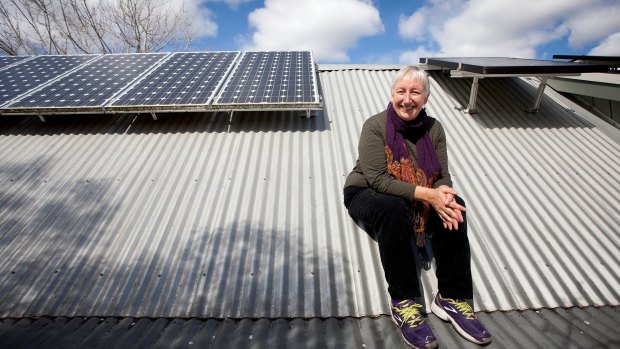 Linda Parlane with the solar panel system at her Coburg home. 