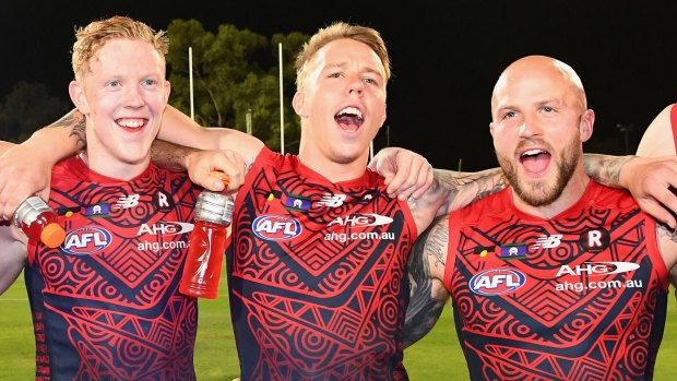 On song: Clayton Oliver, James Harmes and Nathan Jones.