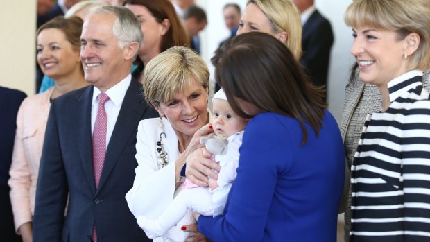 Kelly O'Dwyer's daughter Olivia joined the women in the ministry photo with Prime Minister Malcolm Turnbull on Monday.