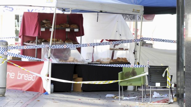 A blood-soaked chair at the Brasserie Bread stand at Westfield Hornsby, where people were injured after police opened fire on a man with a knife.